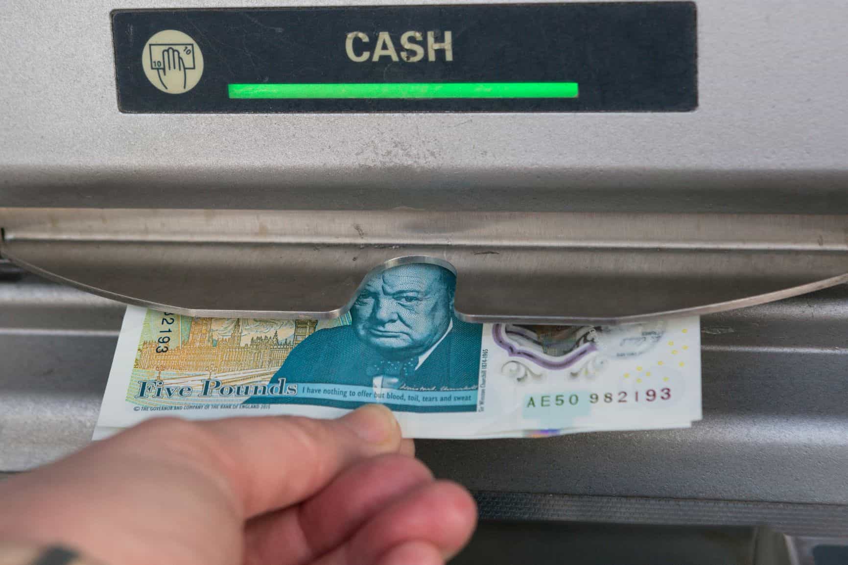 Cash machine and £5 note
